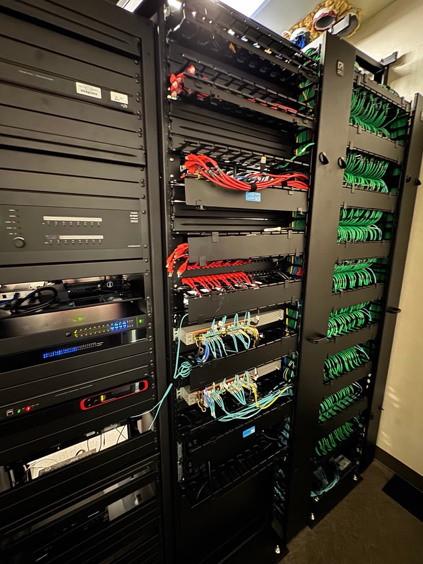 Professional network rack with neatly bundled structured cabling and patch panels