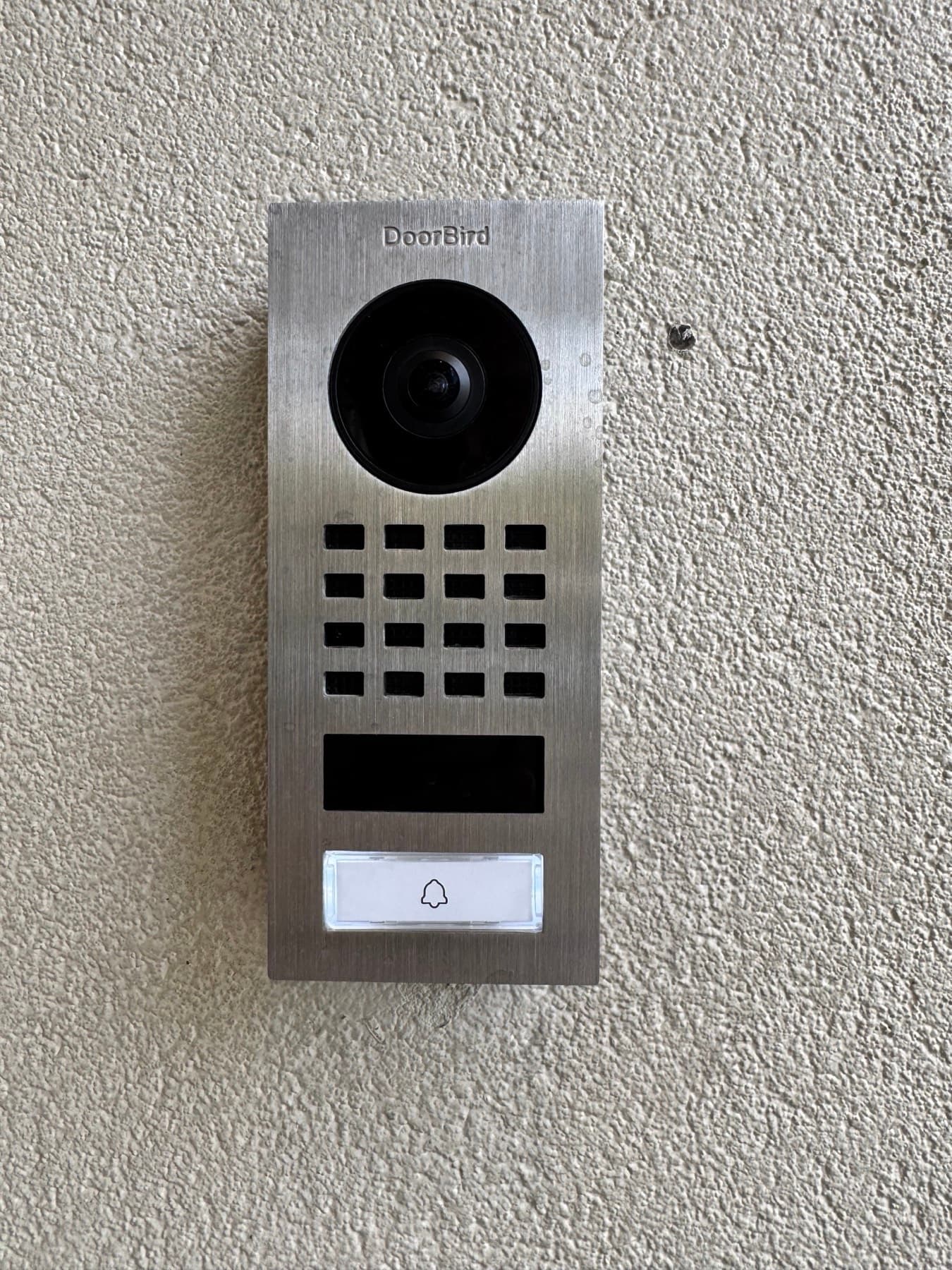 Stainless DoorBird smart video doorbell with camera and intercom installed in West University