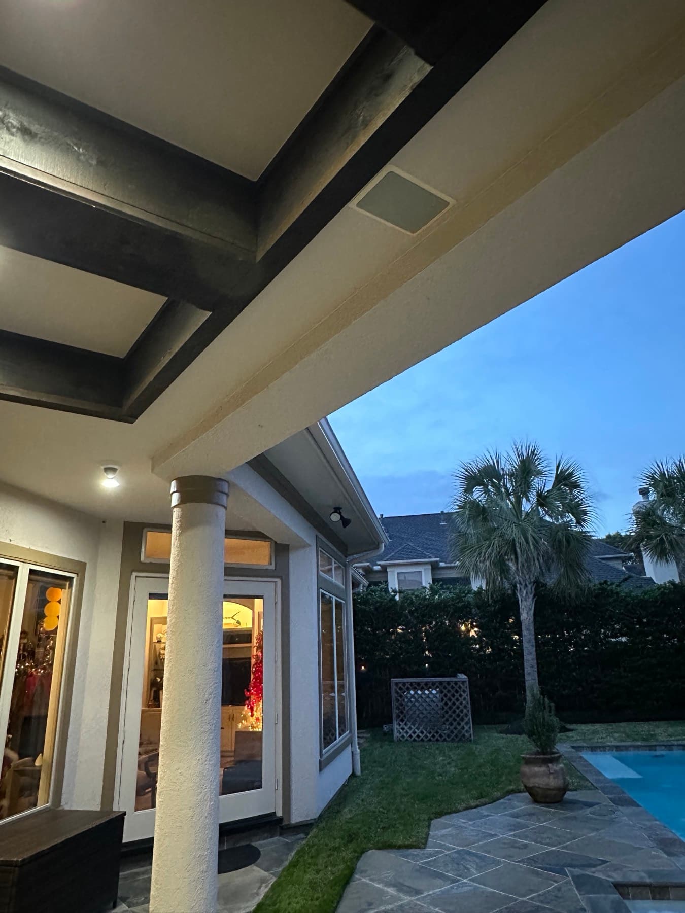 Outdoor patio with landscape audio at dusk